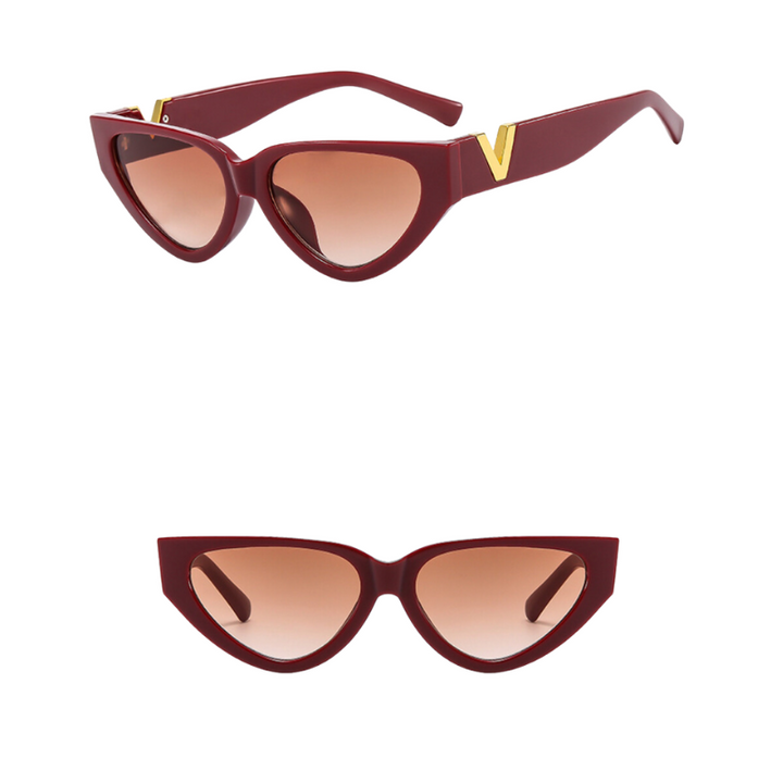 Vintage cat eye sunglasses with a bold burgundy frame, brown-tinted lenses, and UV400 protection. Gold V detail at the side enhances their chic style. Shown from a side angle (top) and front view (bottom) on a white background.