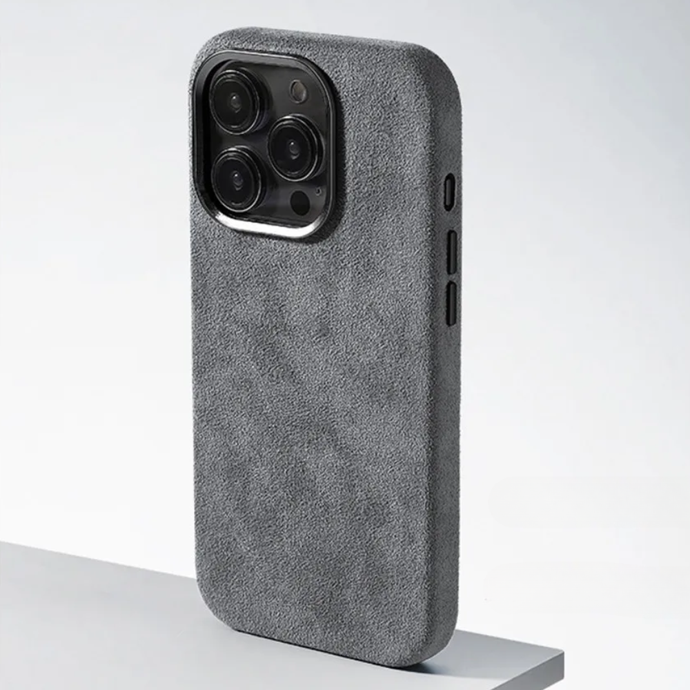 A phone case with four cameras, featuring a protective design and a luxurious suede finish.