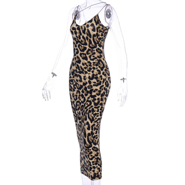 A sleeveless, form-fitting, ankle-length summer statement dress with thin straps and a bold leopard print pattern displayed on a clear mannequin.