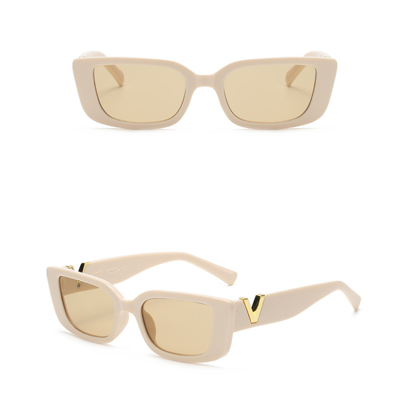 A pair of beige, designer sunglasses with geometric frames and tan lenses shown from the front and at an angle; gold V details are visible on the arms near the hinges.