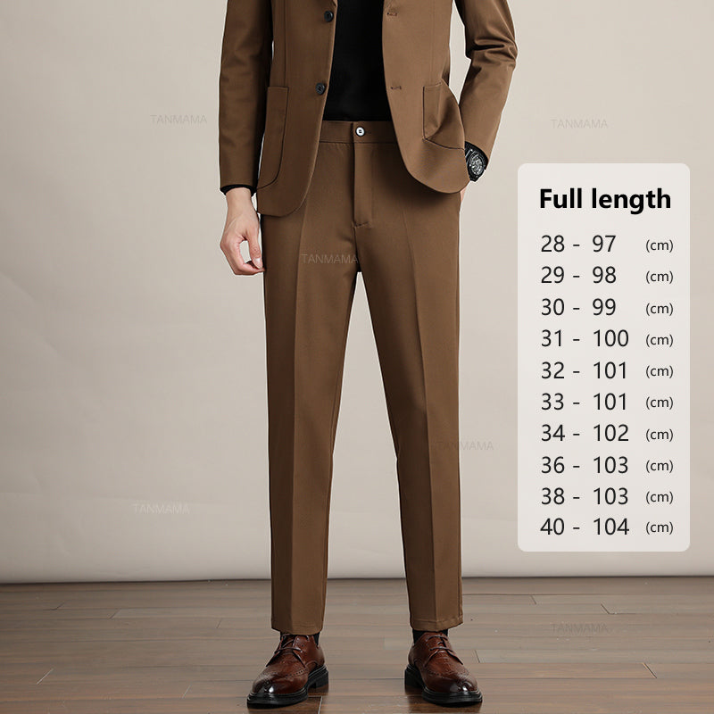 A man in a brown suit stands on a wood floor against a beige background. Next to him, a size chart for Mens Slim Casual Trousers in premium fabric shows pant lengths from 97 cm to 104 cm for sizes 28 to 40.