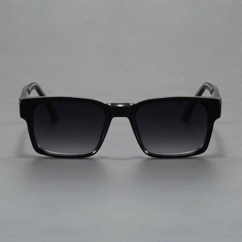 A pair of black square-framed sunglasses with durable frames and dark tinted lenses, featuring modern design and UV400 protection, displayed against a plain grey background.