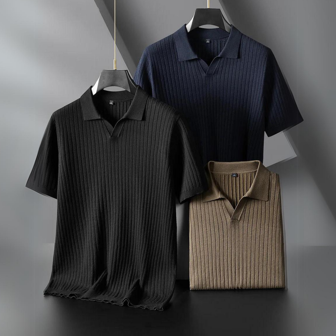 Three short-sleeved, ribbed knit polo shirts in black, navy blue, and beige are displayed on hangers against a geometric, modern background—perfect for the urban professional seeking comfort and style.