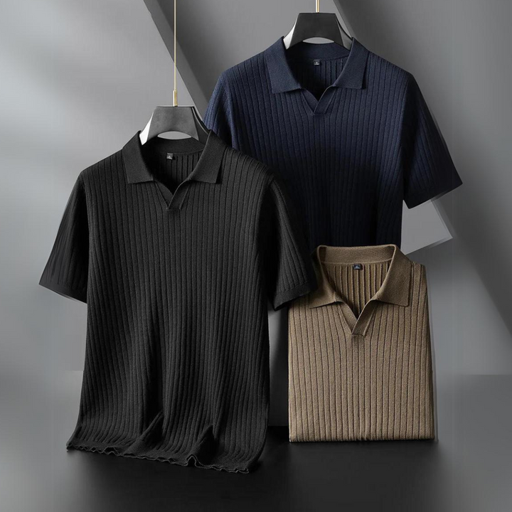 Three short-sleeved, ribbed knit polo shirts in black, navy blue, and beige are displayed on hangers against a geometric, modern background—perfect for the urban professional seeking comfort and style.