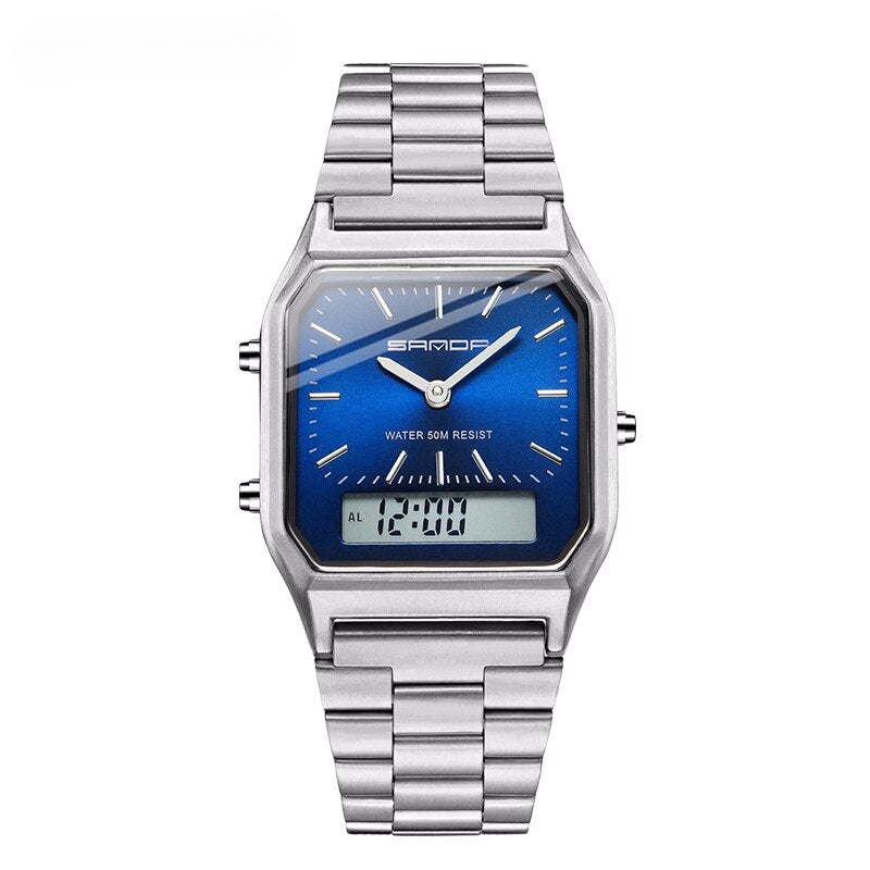 A silver SAMDA wristwatch with a metallic band, blue square face, analog hands, and a small digital display at the bottom showing 12:00. This waterproof sports watch features a dual display and is labeled WATER 50M RESIST.