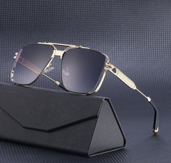 A pair of gold-framed vintage aviator sunglasses with dark gradient lenses and UV400 protection rests on a black, textured eyeglass case against a dark grey, patterned background.