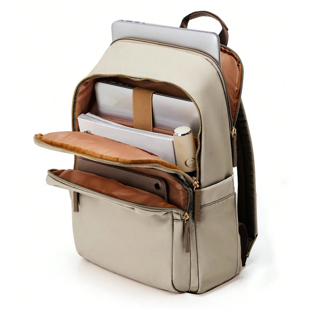 A beige water-resistant backpack with a brown interior is unzipped, showing compartments—including a laptop compartment—holding a laptop, tablet, water bottle, and documents. The lightweight durable backpack has gold zippers and a front pocket.