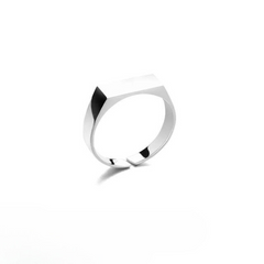 A minimalist, scratch-resistant silver ring with a flat, rectangular top and smooth, polished band, displayed on a white background.