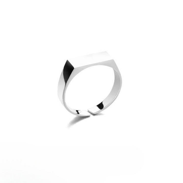A minimalist, scratch-resistant silver ring with a flat, rectangular top and smooth, polished band, displayed on a white background.