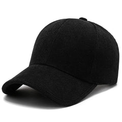 A plain black corduroy baseball cap with a curved brim, displayed on a white background—perfect for fans of classic cord hats and timeless retro hats style.