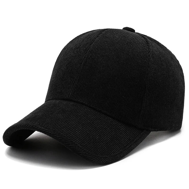 A plain black corduroy baseball cap with a curved brim, displayed on a white background—perfect for fans of classic cord hats and timeless retro hats style.