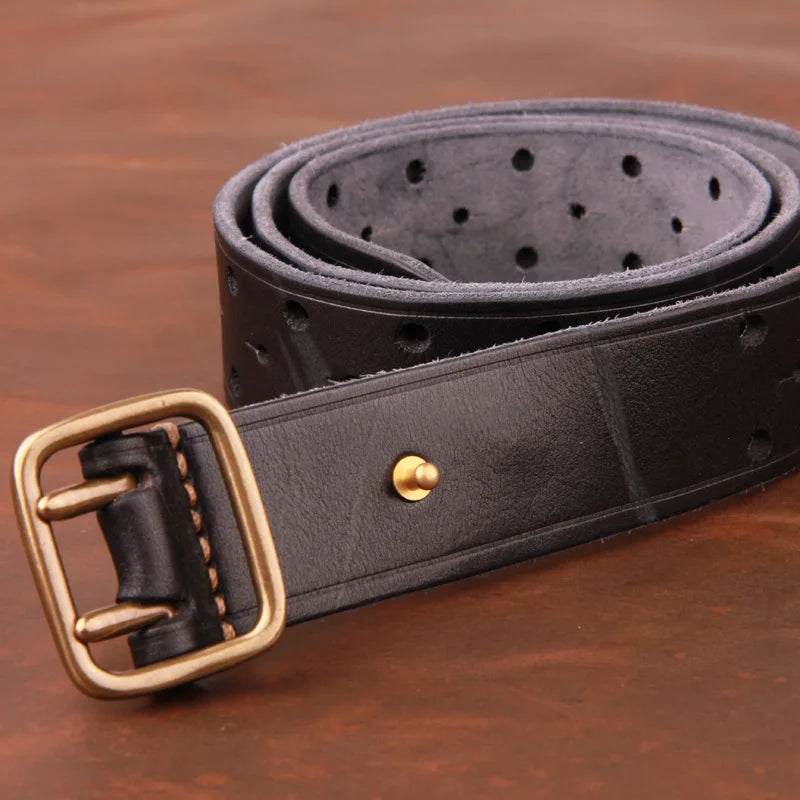 A handcrafted belt made from premium leather, featuring multiple holes and a gold-colored buckle, neatly rolled up and placed on a brown surface.