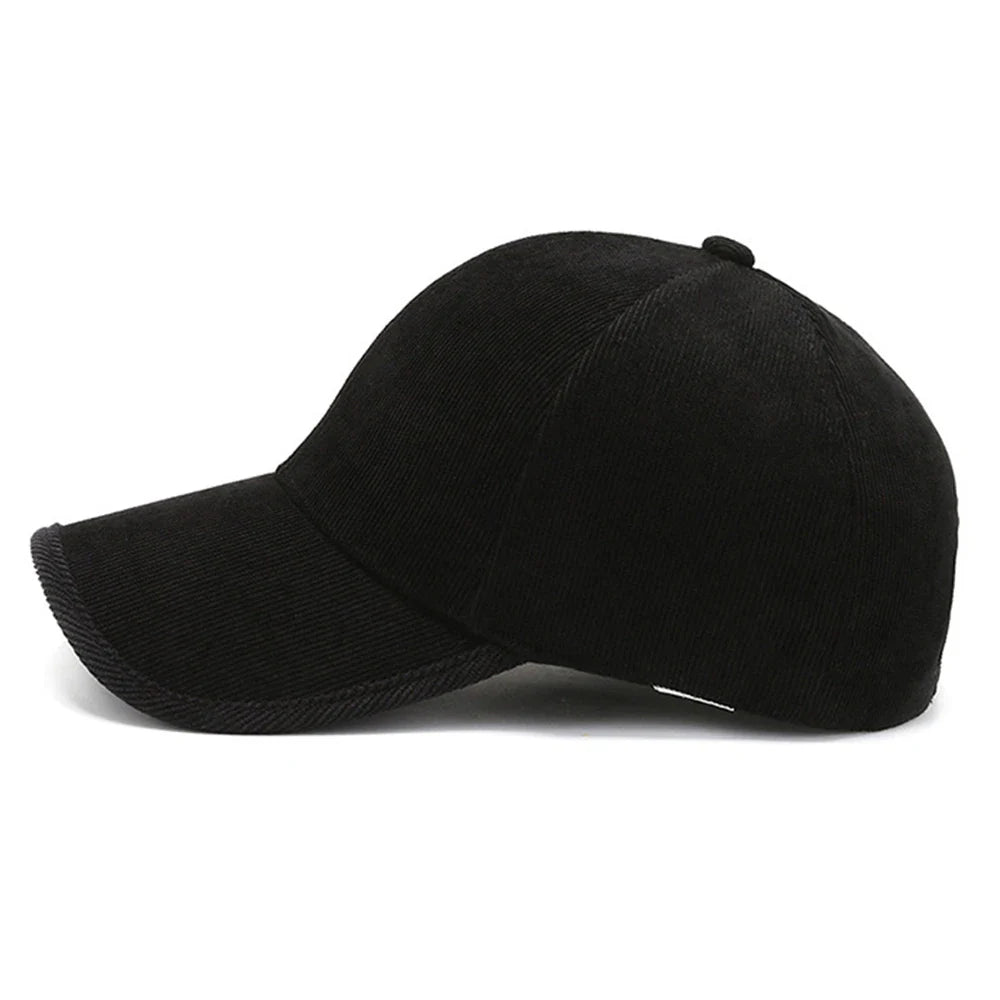 A plain black corduroy baseball cap shown from the side, featuring a curved brim and classic six-panel design—perfect for fans of retro hats and timeless corduroy hats style.