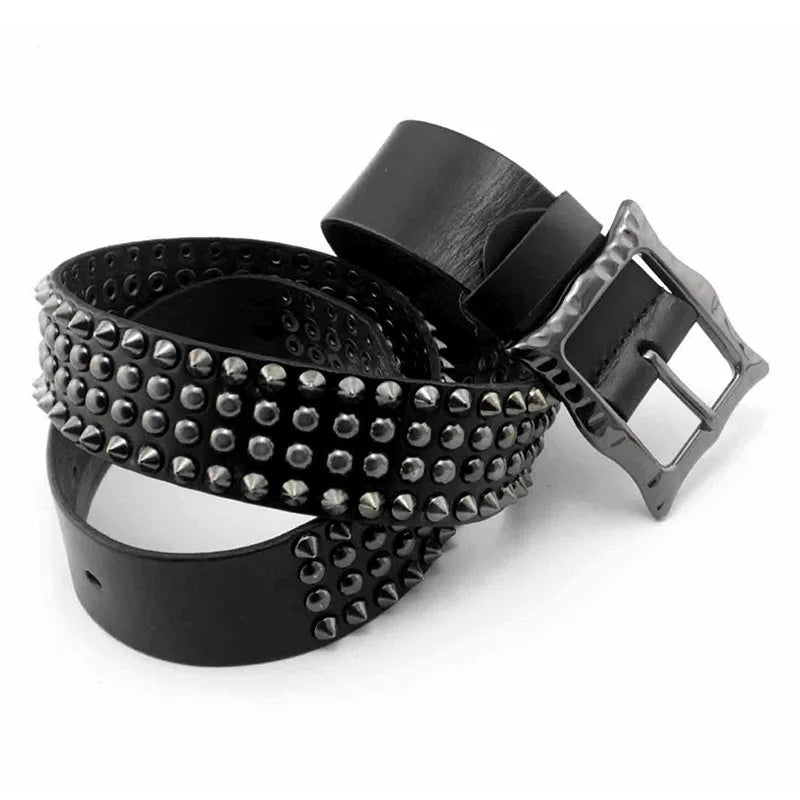 A black leather belt with studded detailing and a large, square, metallic adjustable buckle, coiled in a spiral shape on a white background.