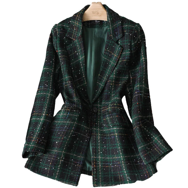 A dark green plaid formal blazer with a single button, tailored fit, and subtle multicolored threads. This stylish jacket coat is displayed on a wooden hanger, revealing its elegant green satin lining inside.