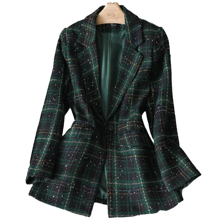 A dark green plaid formal blazer with a single button, tailored fit, and subtle multicolored threads. This stylish jacket coat is displayed on a wooden hanger, revealing its elegant green satin lining inside.