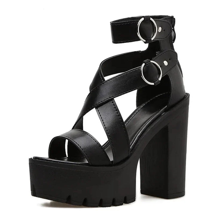 A black high-heeled platform women sandal featuring thick crisscross straps, silver buckle accents, an open toe, chunky heel, and rugged sole with a secure ankle strap.