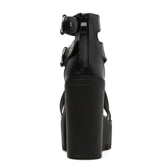 Rear view of black platform women sandals with a thick block heel, open toe, ankle straps with buckles, and a zipper running down the back for closure.