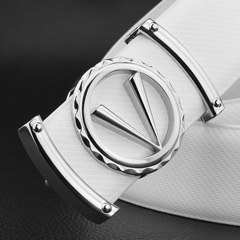 A close-up of a white full-grain leather belt with a shiny silver V-shaped logo buckle, featuring circular and ridged detailing, set against a dark background. The adjustable fit ensures comfort and style.