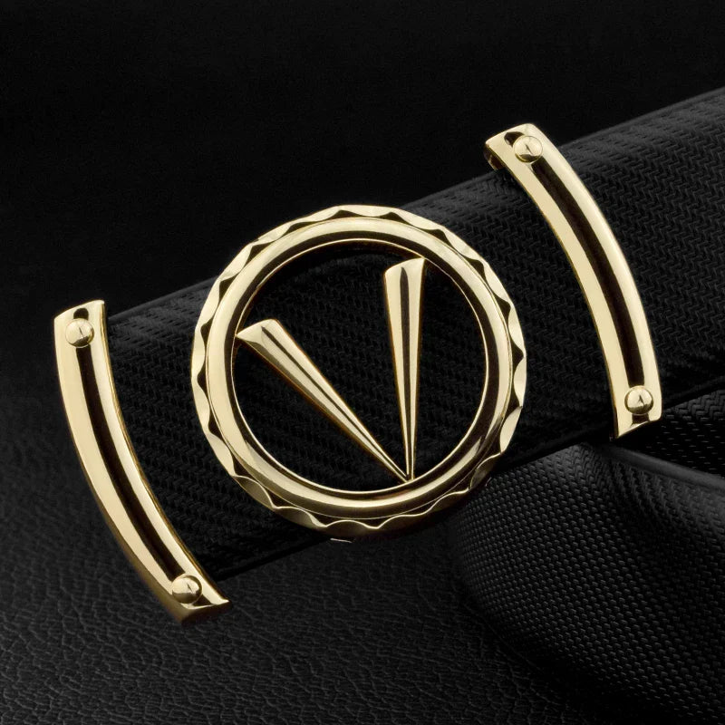 A close-up of a gold belt buckle featuring a circular design with two pointed shapes inside, attached to a textured full-grain leather belt with an adjustable fit, set against a black background.