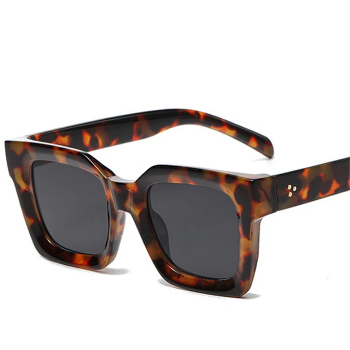 A pair of square-framed sunglasses with a tortoise pattern and durable acetate frames.