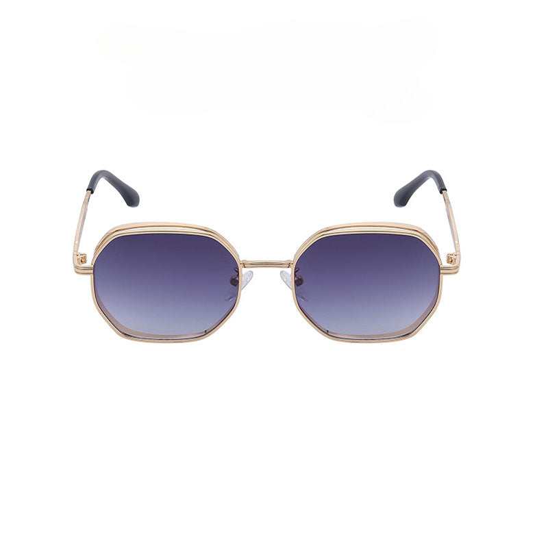 Vintage-inspired sunglasses with gold-tone frames, featuring hexagonal lenses that fade from dark blue to clear. The black-tipped temples and UV400 protection combine style and safety. Displayed on a white background.