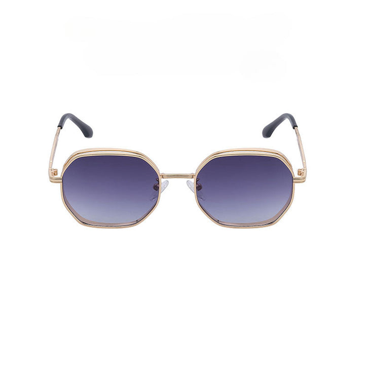 Vintage-inspired sunglasses with gold-tone frames, featuring hexagonal lenses that fade from dark blue to clear. The black-tipped temples and UV400 protection combine style and safety. Displayed on a white background.