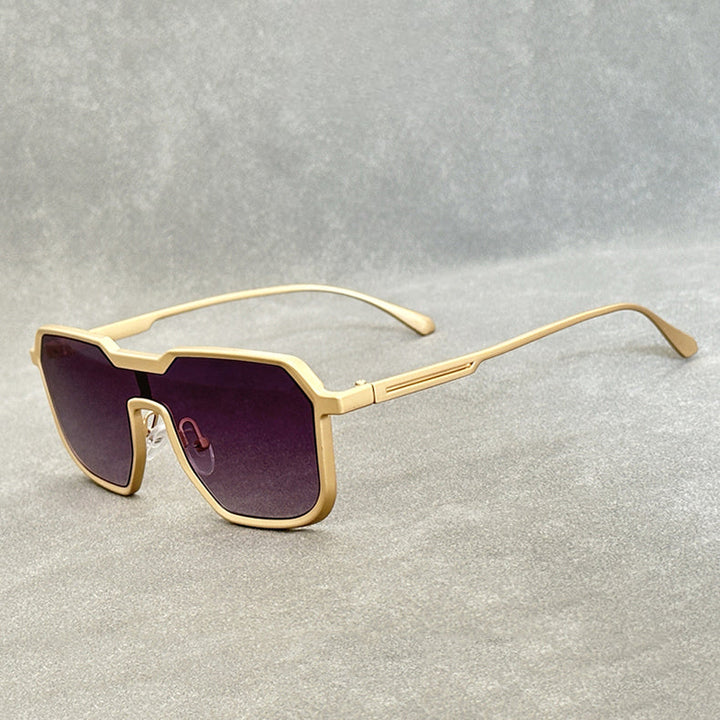 Gold-framed Steampunk Sunglasses with large, geometric purple-tinted lenses and square frames are displayed on a light gray textured surface.