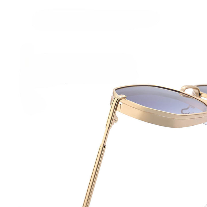 Gold-tone frames and dark tinted lenses define these vintage-inspired sunglasses, shown in close-up from the side and front against a plain white background.