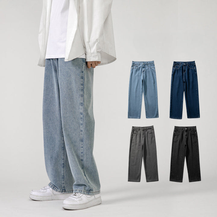 A person wearing Men’s Baggy Jeans with a wide-leg design, white sneakers, a white shirt, and overshirt stands against a plain background. Four additional color options for the jeans are displayed: light blue, dark blue, gray, and black.