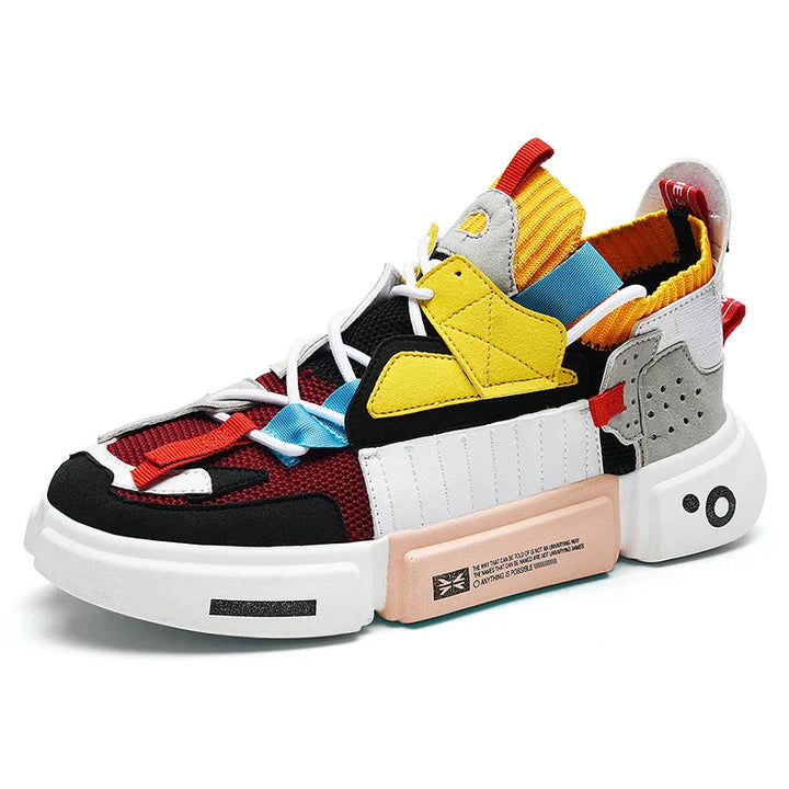 A colorful pair of Extreme VS7 Sneakers with a chunky white sole, featuring panels in red, black, yellow, blue, pink, and gray. These streetwear sneakers offer white laces, various textures, geometric shapes, and lightweight breathable comfort.