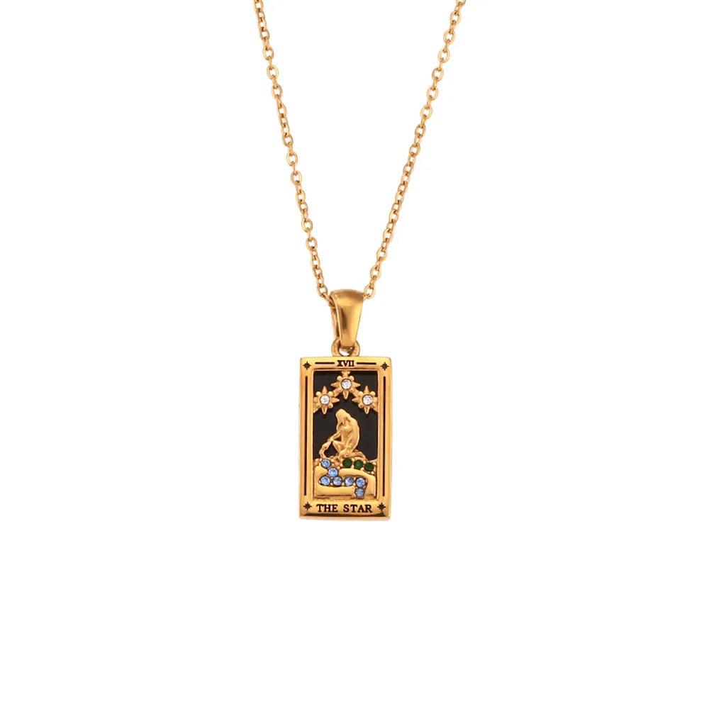 A Solaris Pendant Necklace, this 18K gold-plated chain features a rectangular tarot card pendant labeled THE STAR, adorned with blue enamel accents and colorful gemstones set against a striking black background.