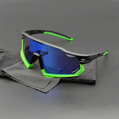 A pair of sporty Olympus Sunglasses with blue mirrored polarized lenses, a black frame, and neon green accents, resting on a black cleaning cloth on a dark surface for ultimate UV protection.
