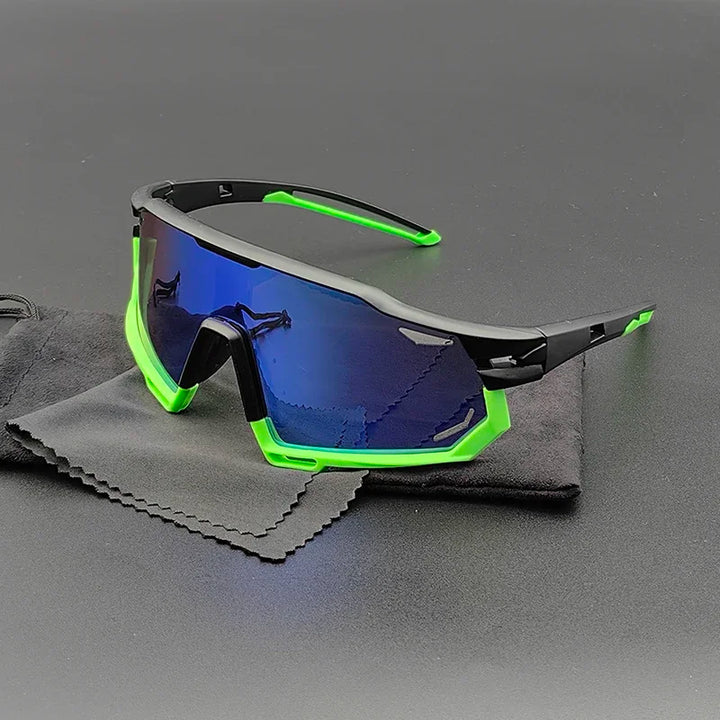 A pair of sporty Olympus Sunglasses with blue mirrored polarized lenses, a black frame, and neon green accents, resting on a black cleaning cloth on a dark surface for ultimate UV protection.