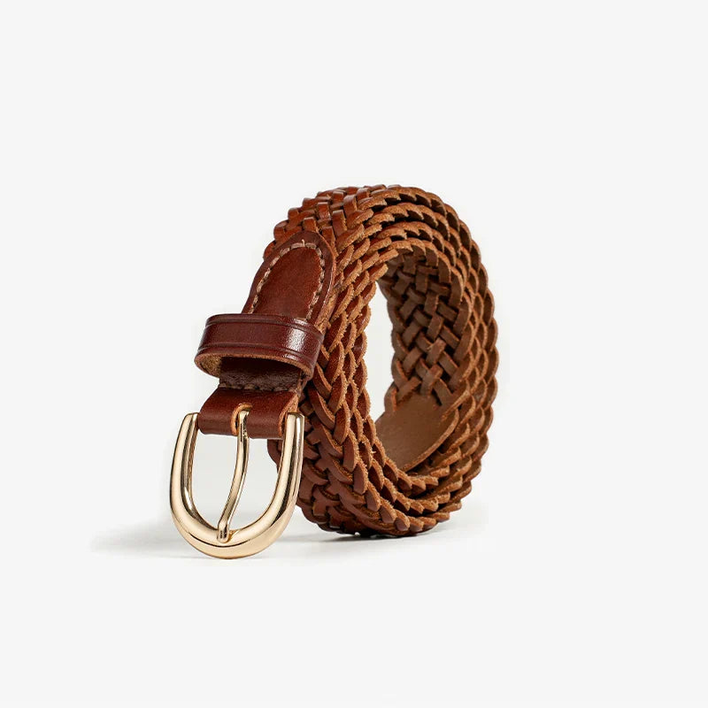 A brown woven Italian leather belt with artisanal craftsmanship, featuring a gold metal buckle, coiled upright on a plain white background.