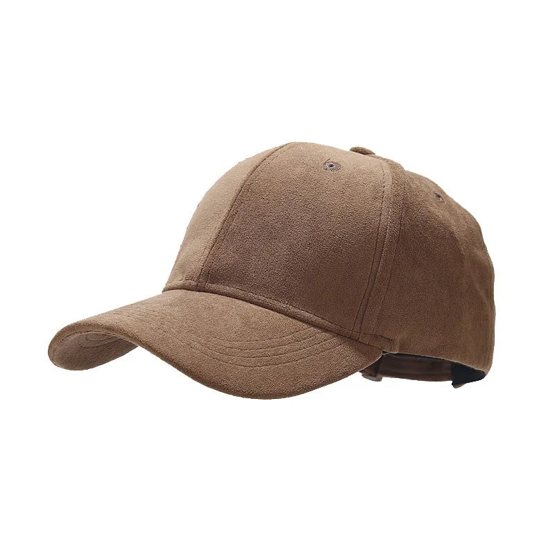 A brown suede baseball cap with a curved brim and visible stitching, shown from a front-side angle against a white background. Perfect for unisex streetwear caps enthusiasts seeking retro baseball caps style.
