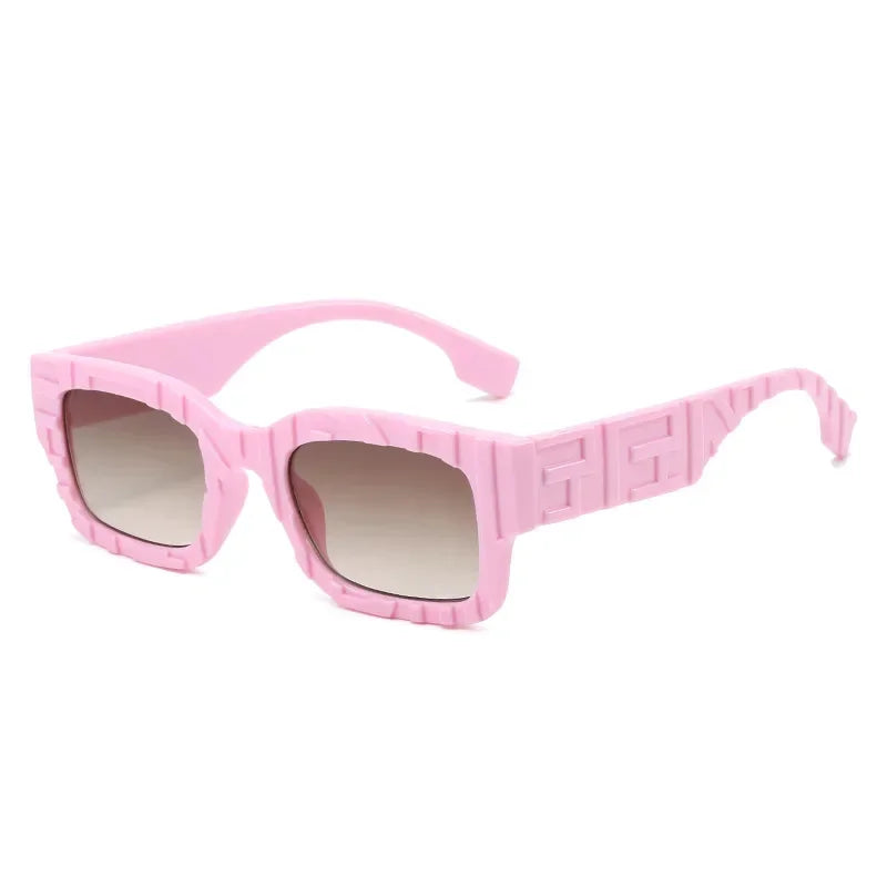 Square-shaped pink vintage sunglasses with thick, textured frames and gradient lenses, featuring a raised pattern along the sides and arms for a bold look. Enjoy UV400 protection for stylish, safe wear in any sunlight.