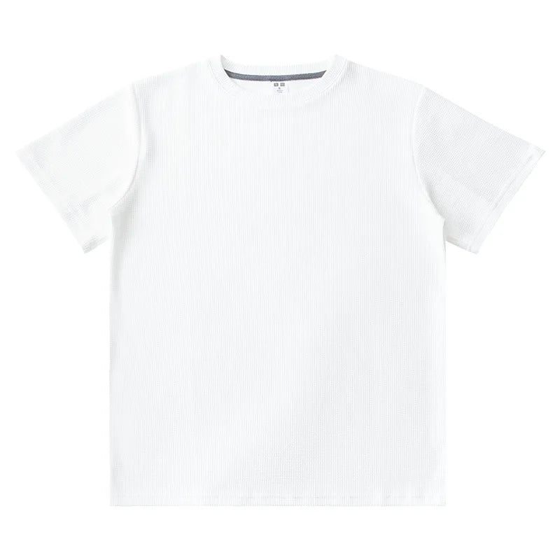 A plain white heavyweight shirt is laid flat on a white background, featuring a simple crew neckline and no visible logos or designs.
