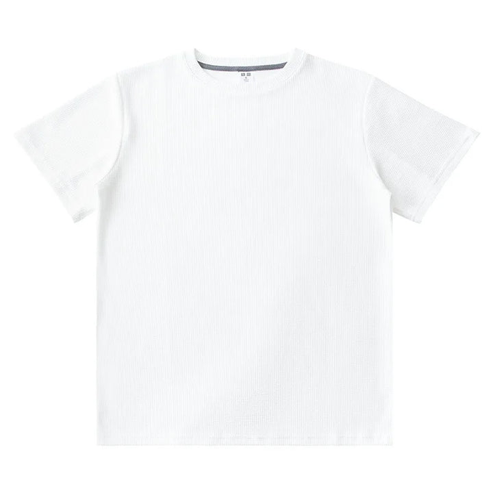 A plain white heavyweight shirt is laid flat on a white background, featuring a simple crew neckline and no visible logos or designs.