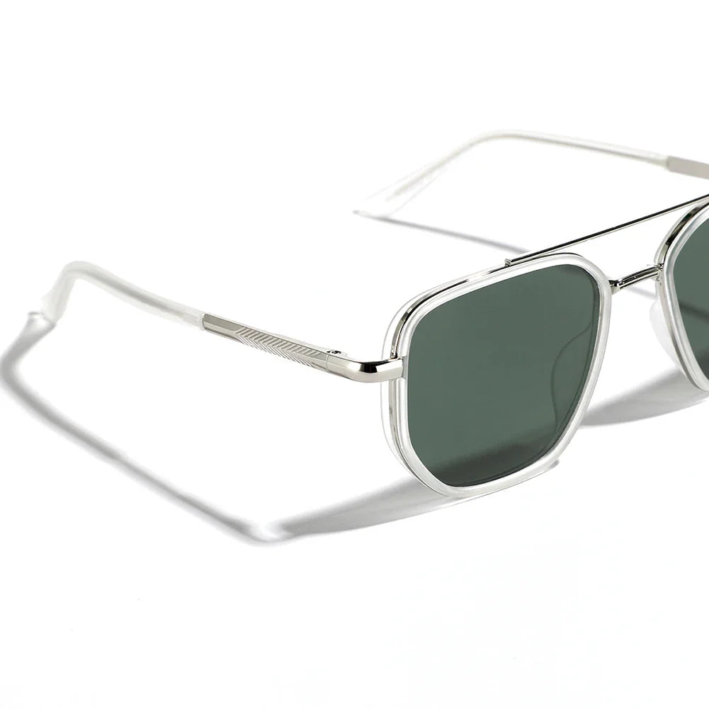 A close-up view of retro style silver metal sunglasses with dark green rectangular lenses, UV400 protection, thin frames, and clear temple tips, casting a shadow on a white surface.