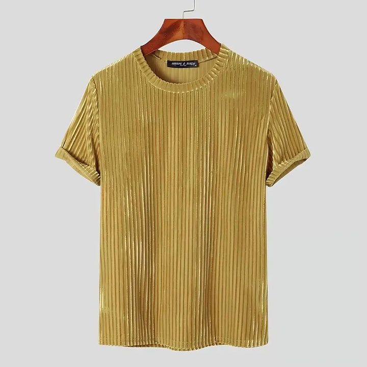 A short-sleeved, gold-colored velvet stripe corduroy tee with vertical pleats and a classic fit, displayed on a wooden hanger against a plain light background.