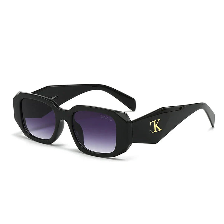 Black rectangular oversized acetate sunglasses with thick frames, dark gradient lenses, UV400 protection, reinforced hinges, and a gold K logo on the arms, displayed on a white background.