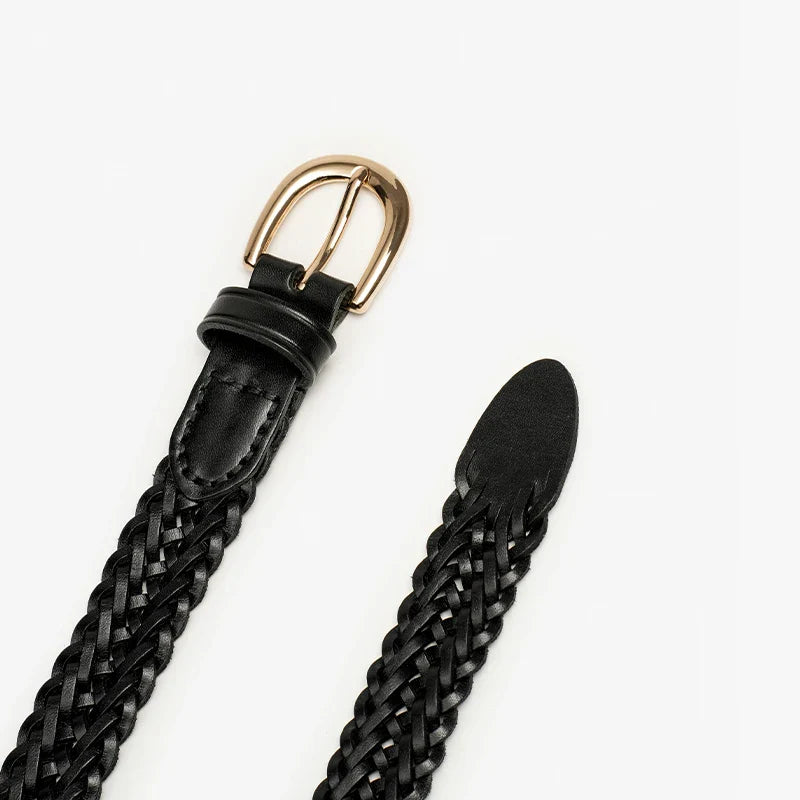 A black Italian leather belt with artisanal craftsmanship is displayed on a white background. The braided, woven belt features a gold buckle and is shown partially unbuckled, with both ends visible.