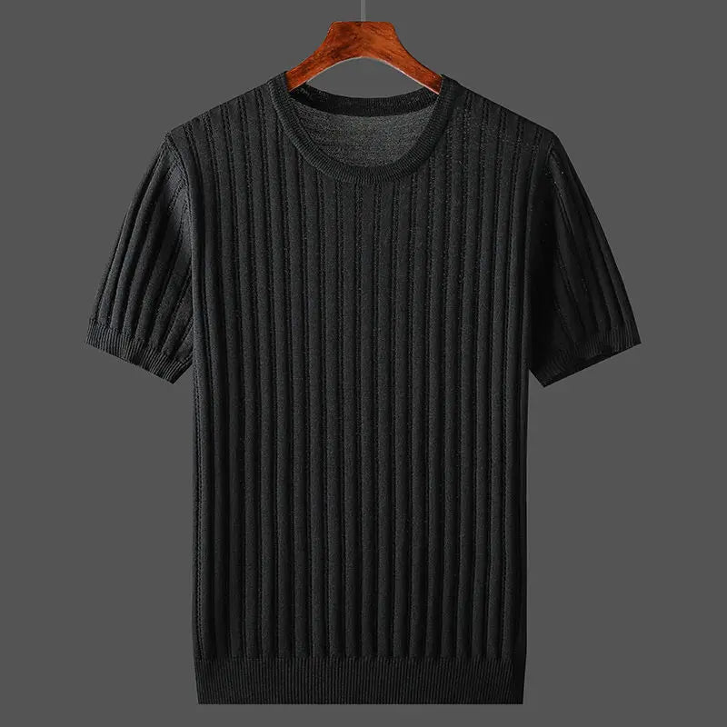 A black, short-sleeve, ribbed knit sweater with a classic fit is displayed on a wooden hanger against a plain gray background.
