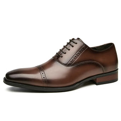 A polished brown Italian leather oxford dress shoe with broguing, a closed lacing system, and a low wooden heel, shown in side profile on a white background.