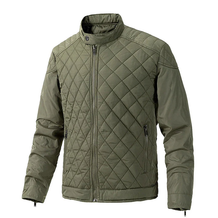 Olive green slim-fit jacket with a stand-up collar, zippered front, and side zip pockets. The sleeves and sides are smooth, while the front and back feature a diamond quilted pattern with wind-resistant comfort.