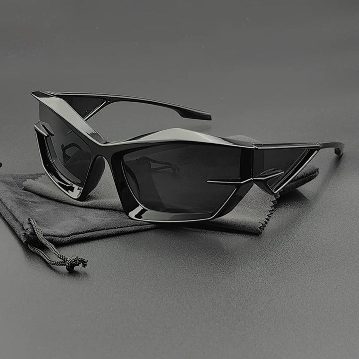 A pair of futuristic, angular black cycling glasses with UV400 protection and dark, high-contrast lenses rests on a matching black drawstring pouch against a smooth, dark background.