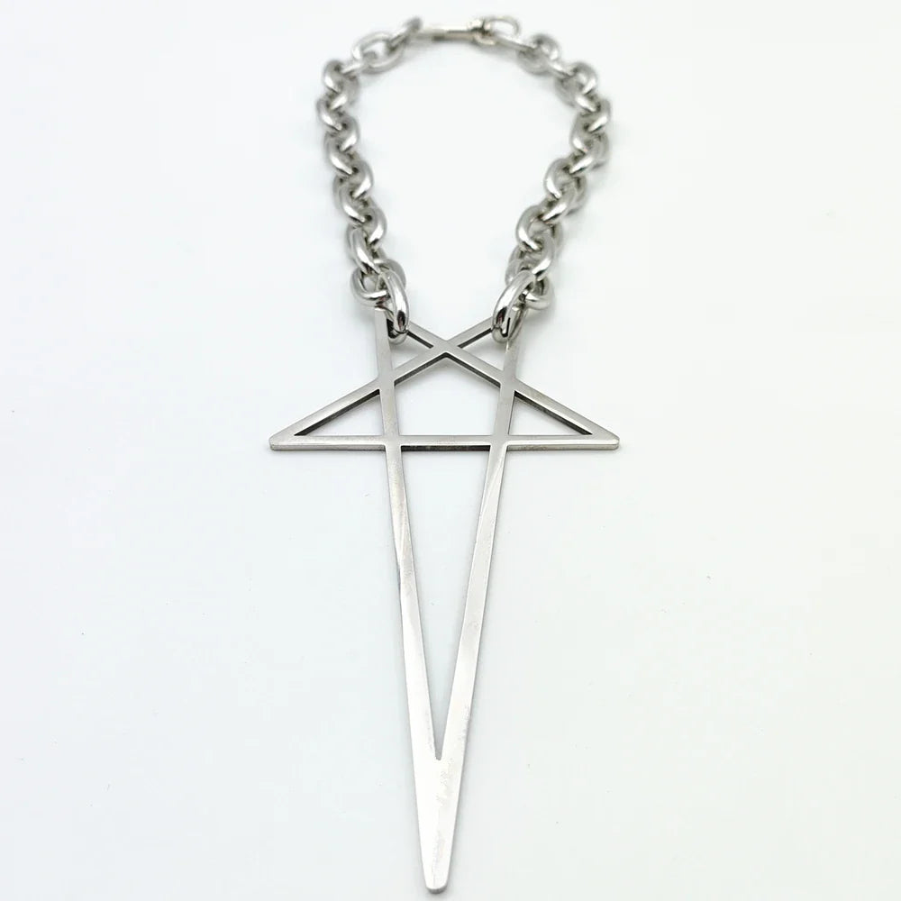 A silver stainless steel necklace features a large geometric pendant shaped like an elongated cross with an intersecting triangle near the top. Modern and minimalist, this pendant necklace makes a striking addition to streetwear jewelry collections.
