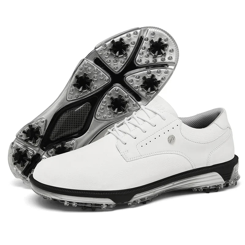 A pair of white waterproof golf shoes with black and clear spiked soles. One shoe is upright showing the side view, while the other is angled to display the bottom grip and advanced grip technology tread design.