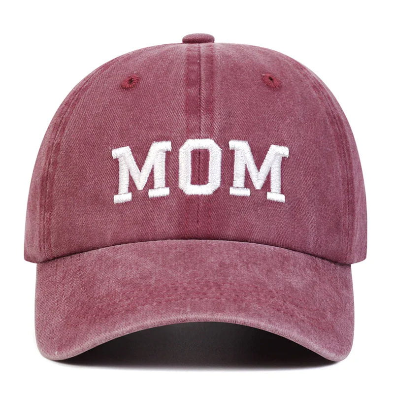 A maroon vintage streetwear embroidered cap with the word MOM in bold white letters on the front—perfect for fans of the classic Mom & Dad cap style.